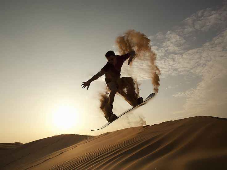 Sandboarding adventure on golden dunes